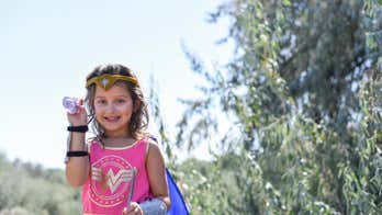 Washington girl celebrates recovery with ‘Wonder Woman’ photoshoot after nearly losing sight in one eye