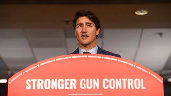 Justin Trudeau tries to put blackface scandal behind him, pledges to ban assault rifles in Canada