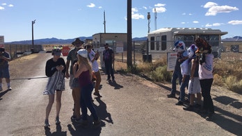 'Storm Area 51' has alien 'believers' mostly standing near a gate, looking 'to the skies,' feeling the spirit