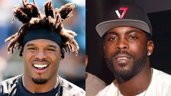 Michael Vick criticizes Cam Newton's flamboyant outfits: 'This isn't a fashion show'
