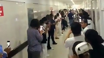 Hospital staff lines halls to pay tribute to organ donor on way to operating room