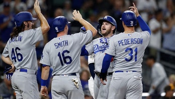Muncy hits slam for Dodgers, who get NL home-field edge
