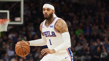 Philadelphia 76ers' Mike Scott appears to get into fight with Eagles fans