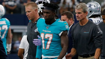 Miami Dolphins' Allen Hurns takes two brutal blows to the head on one play