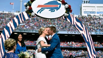 Two Buffalo Bills fans tie the knot at halftime during game vs. New England Patriots