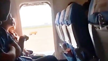 Plane passenger opens emergency exit for 'a breath of fresh air'