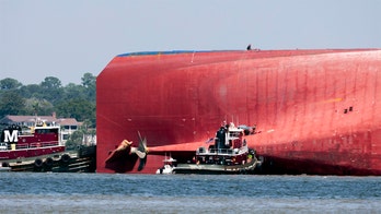 Coast Guard has freed all 4 crew members from capsized cargo ship: officials