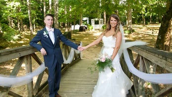 Bride and groom's wedding crashed by black bear during incredible photo shoot