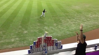 Miami Marlins' Austin Dean shows off dead aim in delivering perfect throw at fans' beer can pyramid