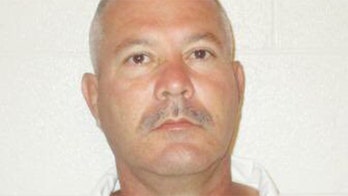 Arkansas killer's second escape ends after capture on prison roof