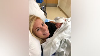 Woman gives birth on side of road after hitting rush-hour traffic en route to hospital