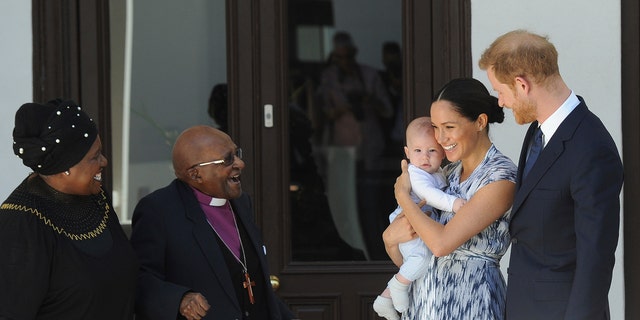 Britain's Prince Harry and Meghan, Duchess of Sussex, holding their son Archie, meet Anglican Archbishop Emeritus, Desmond Tutu and his wife Leah in Cape Town, South Africa,Wednesday, Sept. 25, 2019. (Associated Press)