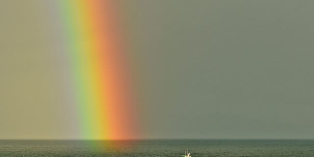 Conception photographed returning to Santa Barbara Harbor on Jan. 12, 2019, with a rainbow from a winter storm as seen from Shoreline Park in Santa Barbara.