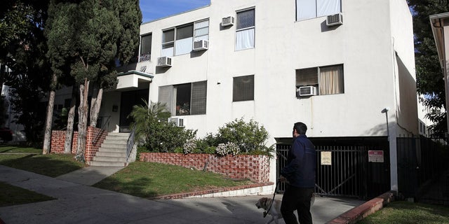 This Jan. 8, 2019 file photo shows the building housing the apartment of Ed Buck in West Hollywood, Calif., following the death of a man the previous day. The prominent LGBTQ political activist was arrested Tuesday, Sept. 17, 2019 and charged with operating a drug house and providing methamphetamine to a 37-year-old man who overdosed on Sept. 11, but survived, officials said. Two other men have died in his apartment since 2017. (AP Photo/Jae C. Hong, File)