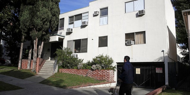 This Jan. 8, 2019 file photo shows the building housing the apartment of Ed Buck in West Hollywood, Calif., following the death of a man the previous day. The prominent LGBTQ political activist was arrested Tuesday, Sept. 17, 2019 and charged with operating a drug house and providing methamphetamine to a 37-year-old man who overdosed on Sept. 11, but survived, officials said. Two other men have died in his apartment since 2017. (AP Photo/Jae C. Hong, File)