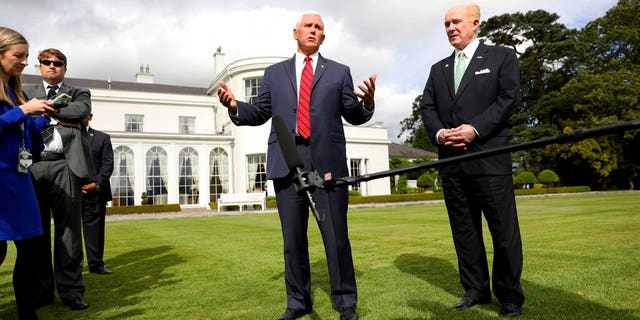 Vice President Pence and U.S. Ambassador to Ireland Edward Crawford speaking at the ambassador's residence in Dublin on Tuesday. (AP Photo/Peter Morrison)