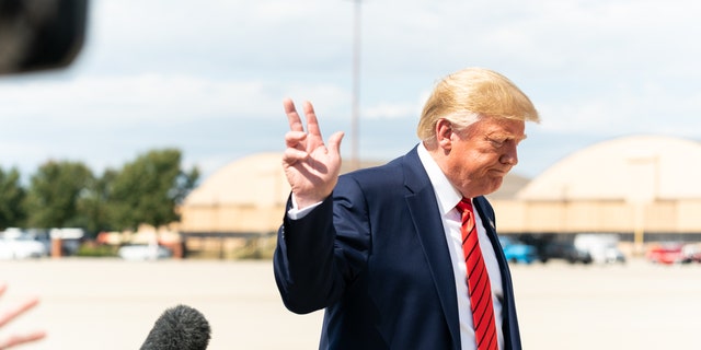 Then-President Donald Trump speaks with reporters after disembarking Air Force One Thursday, Sept. 26, 2019 at Joint Base Andrews, Md.