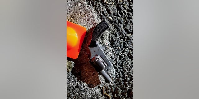 In this photo provided by the New York City Police Department, a handgun recovered at the scene of the shooting. (NYPD via AP)