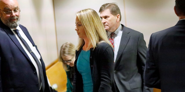 Amber Guyger leaves the audience hall on Thursday. (Tom Fox / Dallas Morning News via AP, Pool)