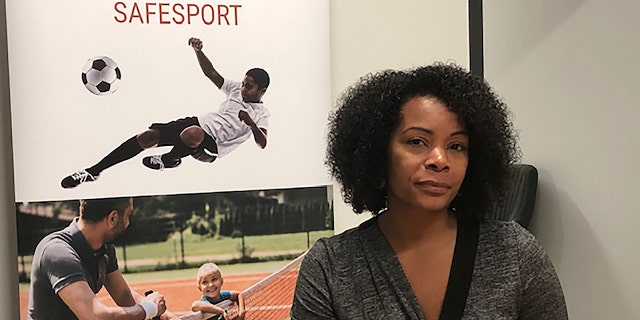 Ju'Riese Colon, the CEO for the U.S. Center for SafeSport, talks about the challenges facing her organization at their headquarters in Denver. (AP Photo/Eddie Pells)