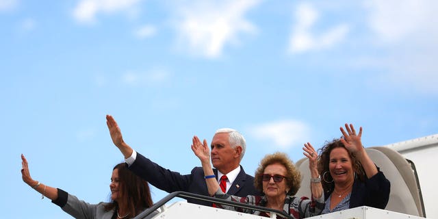 Vice President Pence and members of his family waving goodbye as they board Air Force Two in Dublin on Tuesday. (AP Photo/Peter Morrison)