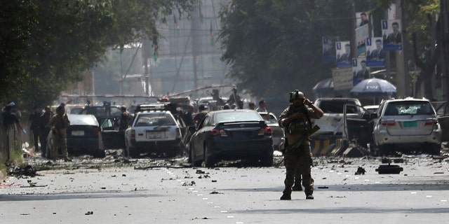 Afghan security personnel arrive at the site of car bomb explosion in Kabul, Afghanistan, Thursday, Sept. 5, 2019.