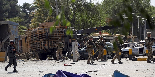 British soldiers arrive at the site of a car bomb explosion in Kabul, Afghanistan, Thursday, Sept. 5, 2019. A car bomb rocked the Afghan capital on Thursday and smoke rose from a part of eastern Kabul near a neighborhood housing the U.S. Embassy, the NATO Resolute Support mission and other diplomatic missions. (AP Photo/Rahmat Gul)