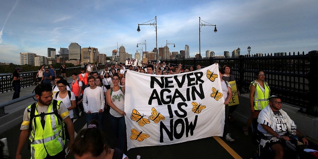 "Never Again Is Now" protesters rally at the New England Holocaust Memorial and then march across the Longfellow bridge into the Amazon local business building lobby, Thursday, Sept. 5, 2019 in Cambridge, Mass. (Associated Press)