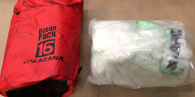 In this Aug. 26, 2019 photo provided by New Zealand Customs, shows a bag of methamphetamine found in a container from Thailand with 469 kilograms of methamphetamine concealed in electric motors. Police said Friday, Sept. 6, 2019, the US$153 million worth of the drug is the largest ever seizure at New Zealand's border. (New Zealand Customs via AP)