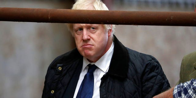 Britain's Prime Minister Boris Johnson visits Darnford Farm in Banchory near Aberdeen, Scotland, Friday Sept. 6, 2019, to coincide with the publication of Lord Bew's review and an announcement of extra funding for Scottish farmers.