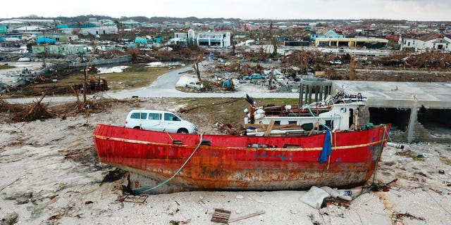 A boat sits grounded in the aftermath of Hurricane Dorian, in Marsh Harbor, Abaco Island, Bahamas, Friday, Sept. 6, 2019.