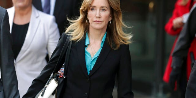 In April, Felicity Huffman departs federal court in Boston after facing charges in a nationwide college admissions bribery scandal. (AP Photos/Charles Krupa, File)