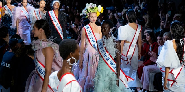 Models sported flower crowns and also carried bunches in baskets and bouquets, as if the blooms were "welcoming different kinds of people in this world, in this country."