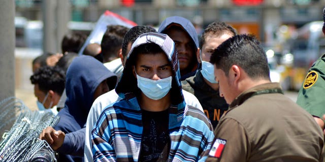 Mexican officials and US border patrol boats fired a group of migrants from the Mexican side of the border last July (AP Photo / Salvador Gonzalez, File)