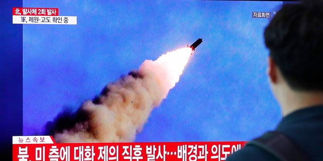 People watch a TV showing a file image of a North Korea's missile launch during a news program at the Seoul Railway Station in Seoul, South Korea, Tuesday, Sept. 10, 2019. 