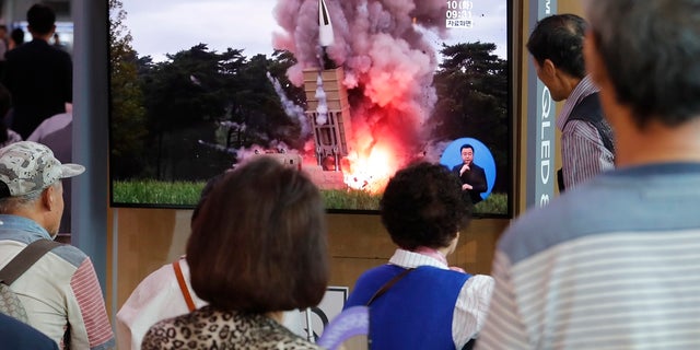 People watch a TV showing a file image of a North Korea's missile launch. (AP Photo/Ahn Young-joon)