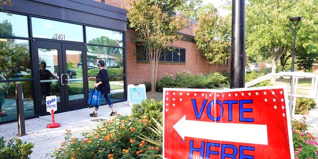 A voters enters Precinct #25 at the West Charlotte Recreation Center, Tuesday, September 10, 2019 as they cast their ballots in the party primaries and in the 9th District race between Dan Bishop and Dan McCready. Voters across Charlotte and the region went to the polls to vote in local Democrat and Republican primaries, while others, in the now infamous 9th District, voted to send either Dan McCready or Dan Bishop to represent them in Congress. (John D. Simmons/The Charlotte Observer via AP)