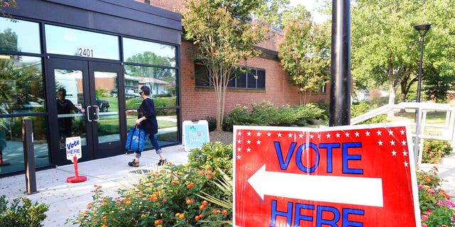 A voter enters a precinct at the West Charlotte Recreation Center Tuesday. (John D. Simmons/The Charlotte Observer via AP)