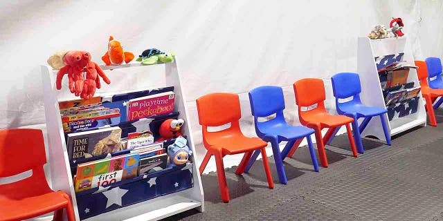 Stuff animals, story books and small chairs fill the Juvenile waiting area at the Migrant Protection Protocols Immigration Hearing Facilities in Laredo, Tuesday, Sept. 10, 2019. (Ricardo Santos/The Laredo Morning Times via AP)