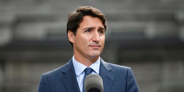 Liberal leader Justin Trudeau talks to media at Rideau Hall in Ottawa, Wednesday, Sept.11, 2019. Trudeau emerged from Rideau Hall after visiting the Governor General and asking her to dissolve Parliament to begin the formal federal election campaign. (Justin Tang/The Canadian Press via AP)