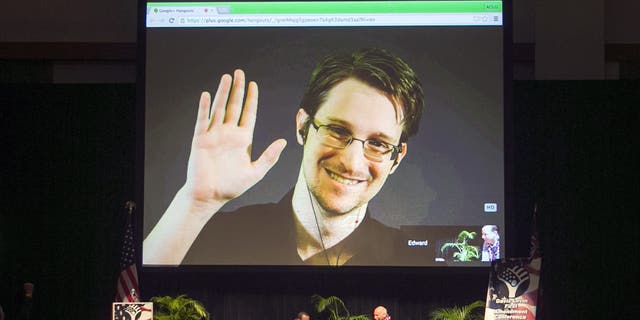 Edward Snowden appears on a live video stream broadcast from Moscow at an event sponsored by ACLU Hawaii in Honolulu on February 14, 2015. (AP Photo / Marco Garcia, File)