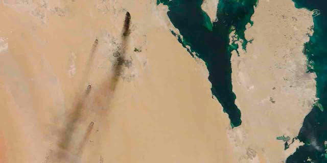 This Saturday, Sept. 14, 2019, satellite image provided by NASA Worldview shows fires following Yemen's Houthi rebels claiming a drone attack on two major oil installations in eastern Saudi Arabia. 