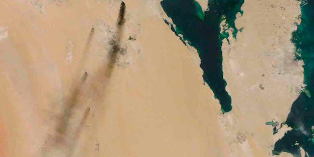 This Saturday, Sept. 14, 2019, satellite image provided by NASA Worldview shows fires following Yemen's Houthi rebels claiming a drone attack on two major oil installations in eastern Saudi Arabia. 