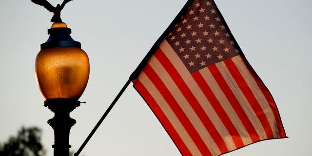 Flags fly at sunset with 51 stars instead of the usual 50 stars along Pennsylvania Avenue, as part of a demonstration in support of statehood for the District of Columbia.