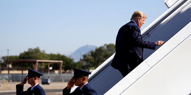 President Donald Trump boarding Air Force One in Albuquerque on his way to California on Tuesday. (AP Photo/Evan Vucci)