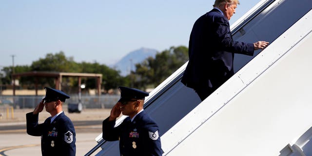 President Donald Trump embarks on Air Force One in Albuquerque to travel to California on Tuesday. (AP Photo / Evan Vucci)