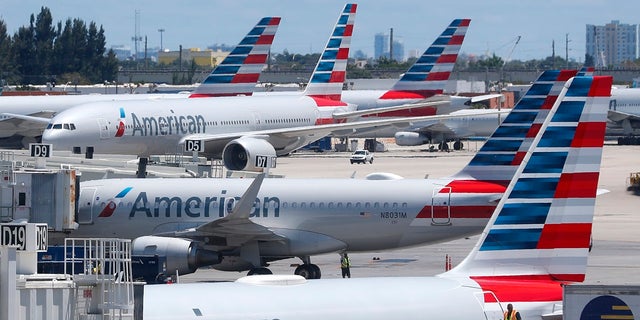 American Airlines aircraft are shown parked at their gates at Miami International Airport in Miami.