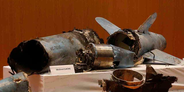 Remains of what was described as a misfired Iranian cruise missile used in an attack this weekend that targeted the heart of Saudi Arabia's oil industry, is displayed during a press conference by Saudi military spokesman Col. Turki al-Malki, in Riyadh, Saudi Arabia, Wednesday, Sept. 18, 2019. Though Yemen's Houthi rebels claimed the assault, the U.S. alleges Iran was behind it. (AP Photo/Amr Nabil)