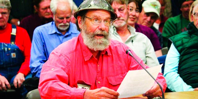 Fritz Creek area resident Barrett Fletcher gives the invocation before a Kenai Peninsula Borough Assembly meeting as a representative of the Church of the Flying Spaghetti Monster at Homer City Hall in Homer, Alaska.