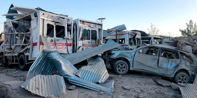 Damaged cars are seen at the site of a suicide attack in Zabul, Afghanistan, Thursday, Sept. 19, 2019. A powerful early morning suicide truck bomb devastated a hospital in southern Afghanistan on Thursday. (AP Photo/Ahmad Wali Sarhadi)